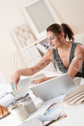 Female interior designer working at office