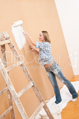 Home improvement: Woman painting wall