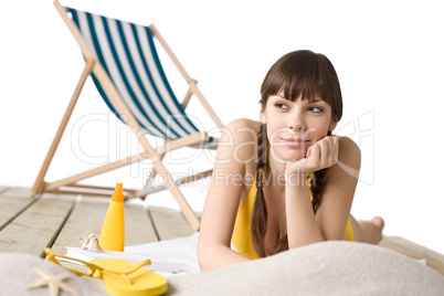 Beach with deck chair - Woman in bikini sunbathing