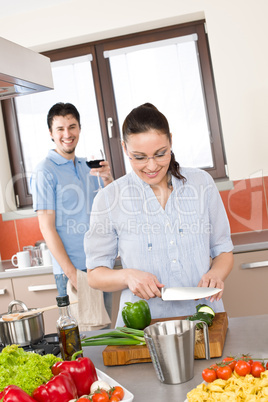 Happy couple cook in modern kitchen