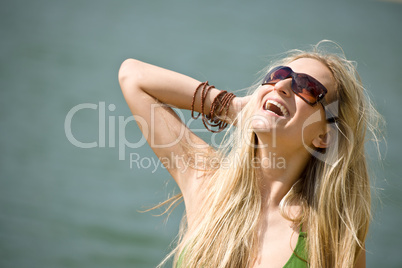 Blond woman in bikini have fun at sea