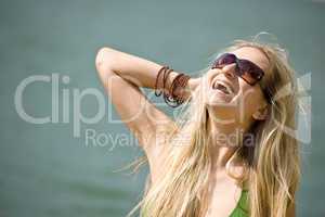 Blond woman in bikini have fun at sea