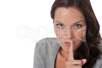 Brown hair woman with  with finger on lips