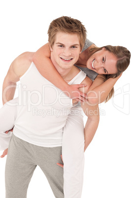 Piggyback - Young sportive smiling  couple