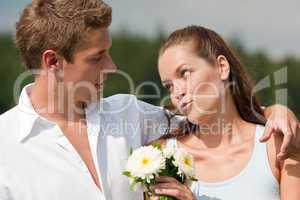 Romantic couple with flower in spring