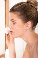 Body care series - Young woman cleaning her face
