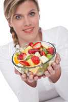 Healthy lifestyle series - Woman holding bowl of fruit salad