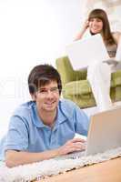 Student - two teenager with laptop in living room