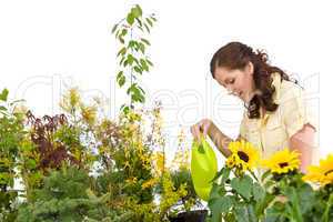 Gardening - Woman pouring plants with watering can