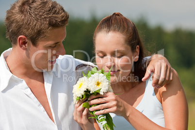 Romantic couple with flower in spring