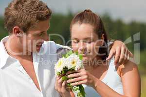 Romantic couple with flower in spring