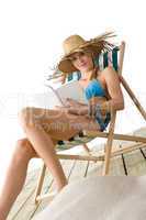 Beach - Young woman relax with book in bikini