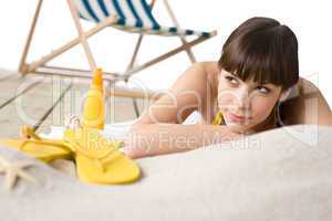 Beach - Attractive woman in bikini sunbathing