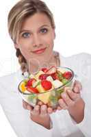 Healthy lifestyle series - Woman holding fruit salad