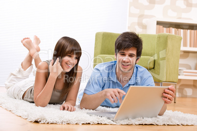 Student - two teenager with laptop in living room