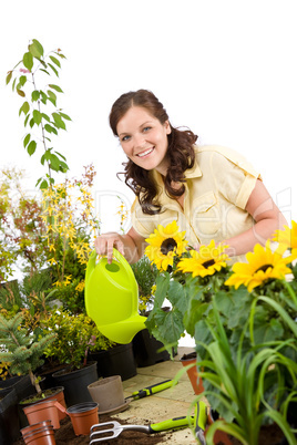 Gardening - Woman pouring sunflowers with watering can