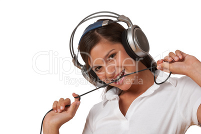 Smiling teenager with headphones listening to music