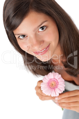 Happy teenager with gerber daisy