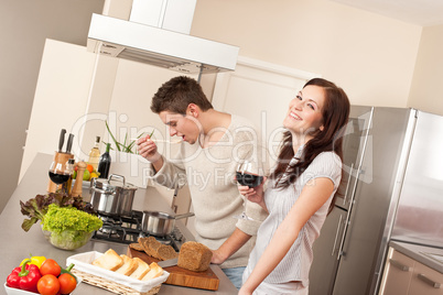 Young couple cooking in kitchen together