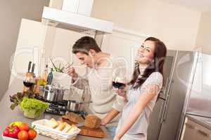 Young couple cooking in kitchen together