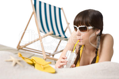 Beach - Woman in bikini with drink and flip-flop on sand