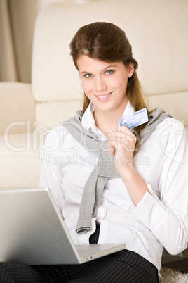 Home shopping - woman with credit card and laptop