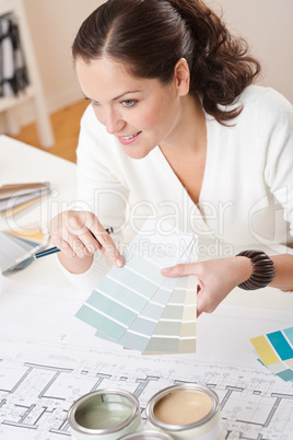 Young female interior designer working at office