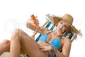 Beach - Young woman apply suntan lotion