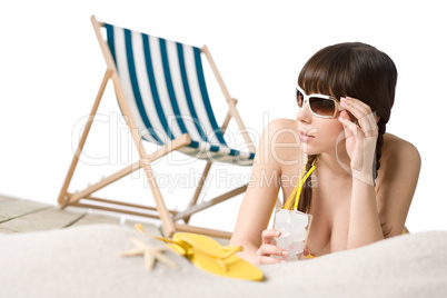 Beach - Woman in bikini with drink and flip-flop on sand