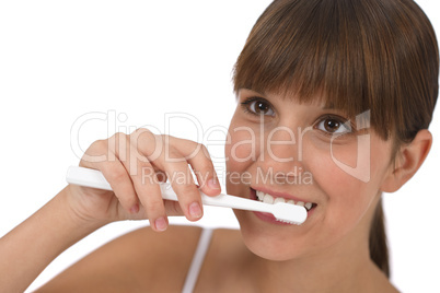 Body care - Female teenager brushing teeth