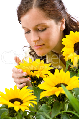 Portrait of beautiful woman with sunflowers