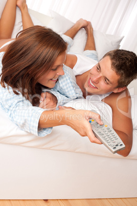 Young couple lying on sofa