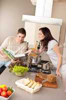 Young couple cooking in kitchen together