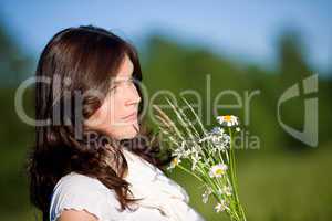 Beautiful woman with daisy flowers