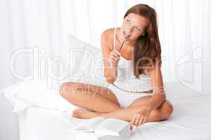 White lounge - Brown hair woman with books and pen