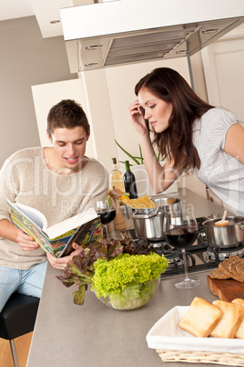 Young couple cooking in kitchen together