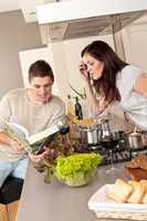 Young couple cooking in kitchen together