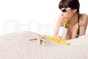 Beach - starfish on sand, woman in bikini out of focus