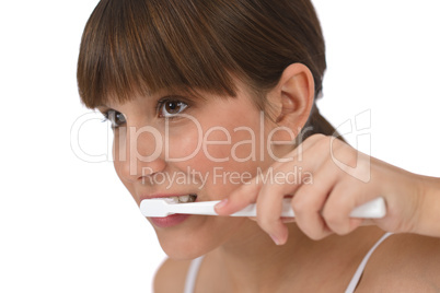 Body care - Female teenager brushing teeth