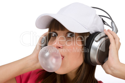 Happy teenager with bubble gum and headphones