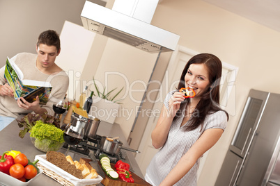 Young couple cooking in modern kitchen