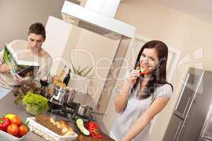 Young couple cooking in modern kitchen