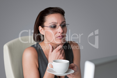 Successful business woman having coffee break