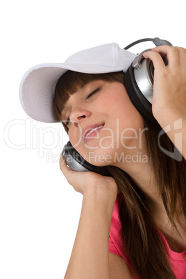 Happy female teenager enjoy music