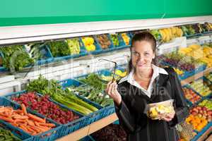 Grocery store shopping - Business woman buying fruit salad