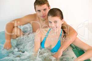 Spa - young loving couple enjoy hot tub