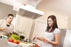 Young couple cooking in kitchen together