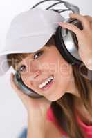 Smiling female teenager enjoy music