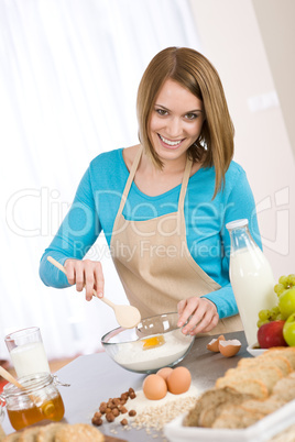 Baking - Smiling woman with healthy ingredients