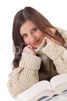 Portrait of young happy woman with book